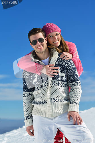 Image of Young Couple In Winter  Snow Scene