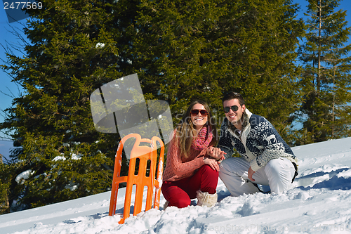 Image of Young Couple In Winter  Snow Scene