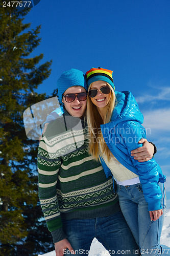 Image of Young Couple In Winter  Snow Scene