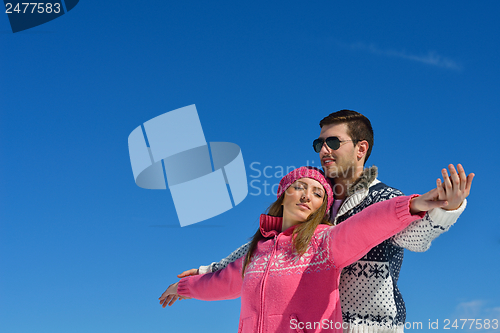 Image of Young Couple In Winter  Snow Scene