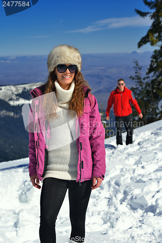 Image of Young Couple In Winter  Snow Scene