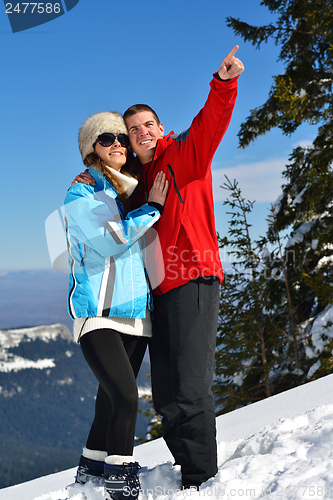 Image of Young Couple In Winter  Snow Scene