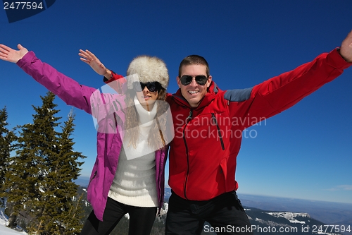 Image of Young Couple In Winter  Snow Scene