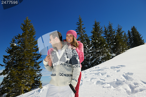 Image of Young Couple In Winter  Snow Scene