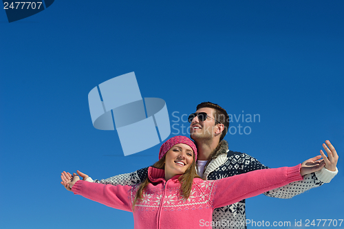 Image of Young Couple In Winter  Snow Scene