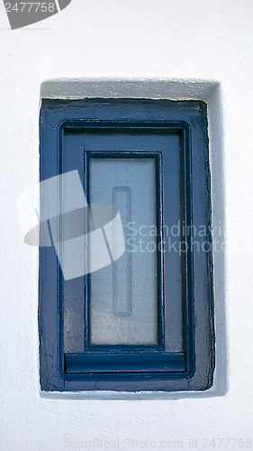 Image of Blue window and white house