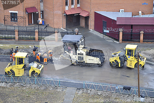 Image of Special equipment on repair of roads. Bulldozer, asphalt spreade