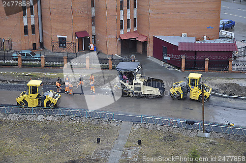 Image of Special equipment on repair of roads. Bulldozer, asphalt spreade