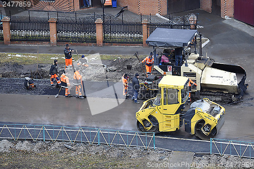 Image of Special equipment on repair of roads. Bulldozer, asphalt spreade