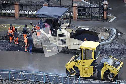 Image of Special equipment on repair of roads. Bulldozer, asphalt spreade