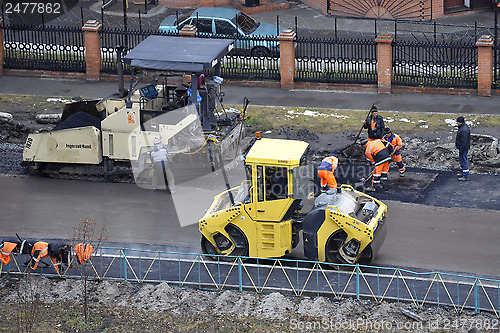 Image of Special equipment on repair of roads. Bulldozer, asphalt spreade