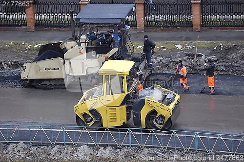 Image of Special equipment on repair of roads. Bulldozer, asphalt spreade