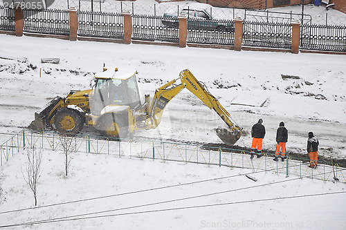 Image of Special equipment on road construction. Snowfall