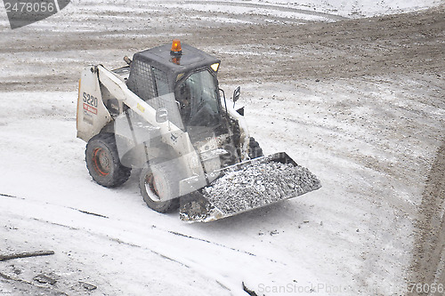 Image of Special equipment on road. Snowfall