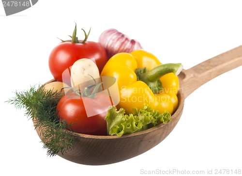 Image of juicy vegetables in a wooden spoon