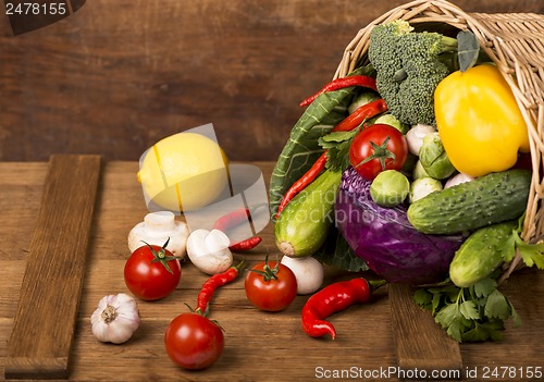 Image of Healthy Organic Vegetables on a Wooden Background