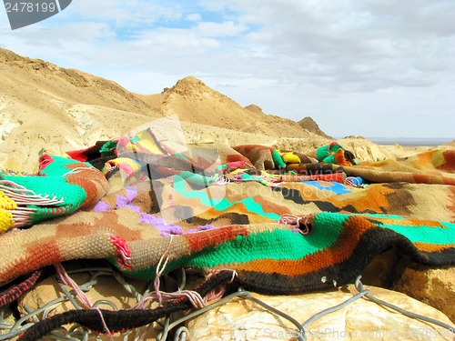 Image of Colorful cloth lying on a background of mountains