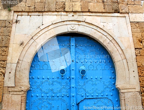 Image of Blue gate in the stone wall