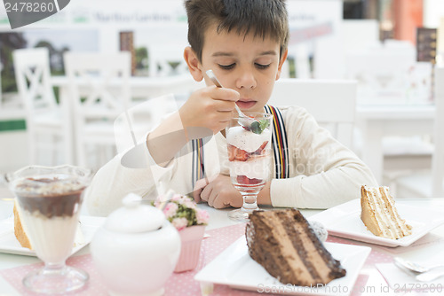 Image of Child eat strawberry smoothie