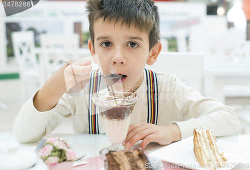 Image of Child eat milk choco shake