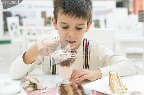 Image of Child eat milk choco shake