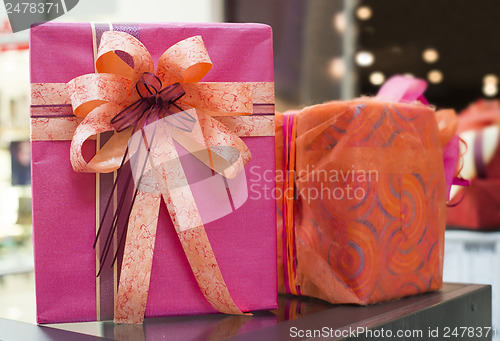 Image of Pink and red Gift boxes in shopping center