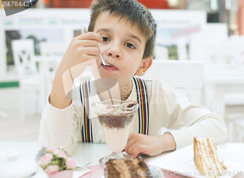 Image of Child eat milk choco shake
