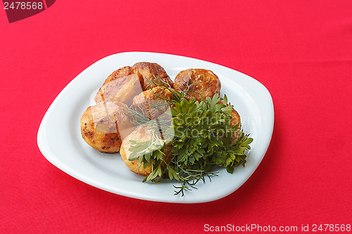 Image of Baked potatoes with dill and parsley