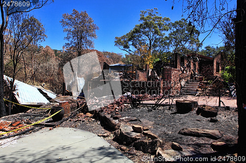 Image of After bushfire, homes razed to the ground.