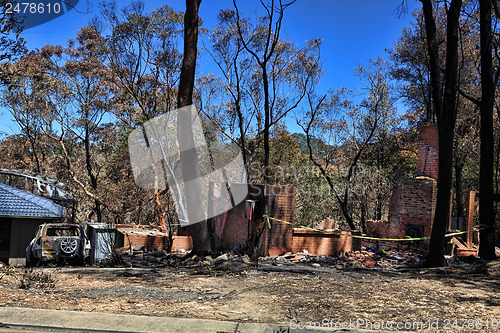 Image of After the fire - burned houses and vehicles