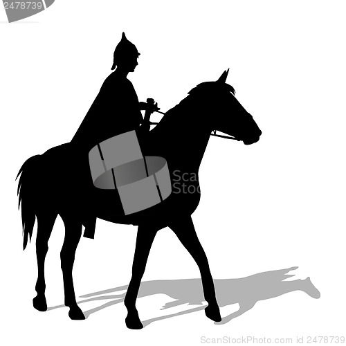Image of Rider on a horse in clothing warrior with a sword and wearing a 