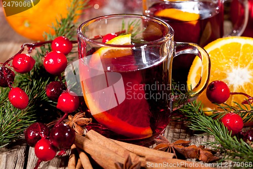 Image of hot tasty spicy mulled red wine with orange and cinnamon christmas 