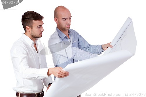 Image of young adult businessman architect with blueprint 