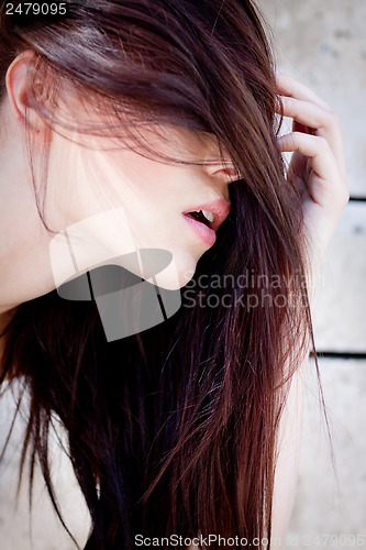 Image of beautiful woman portrait wirth long straight dark brown hair 