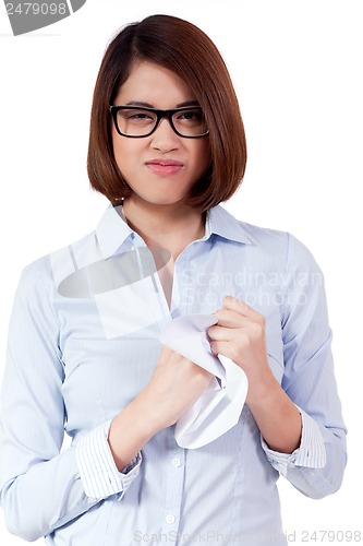 Image of young frustrated asian business woman with paperwork crumpled