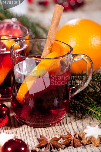 Image of hot tasty spicy mulled red wine with orange and cinnamon christmas 