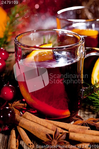 Image of hot tasty spicy mulled red wine with orange and cinnamon christmas 