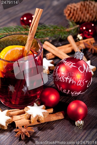 Image of hot tasty spicy mulled red wine with orange and cinnamon christmas 