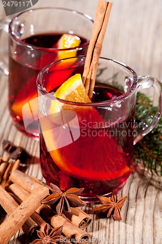 Image of hot tasty spicy mulled red wine with orange and cinnamon christmas 