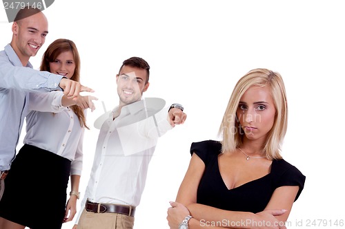 Image of young businesswoman bullying mobbing by team isolated 