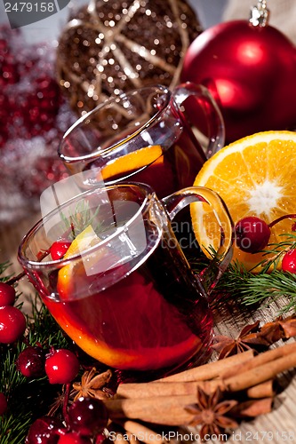 Image of hot tasty spicy mulled red wine with orange and cinnamon christmas 