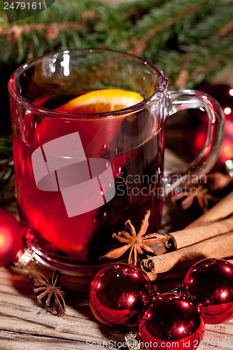 Image of hot tasty spicy mulled red wine with orange and cinnamon christmas 