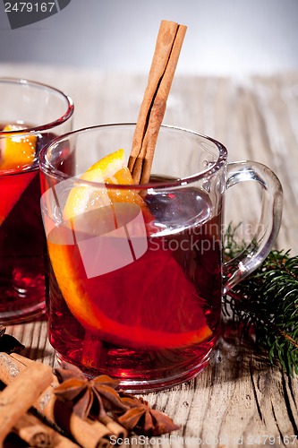 Image of hot tasty spicy mulled red wine with orange and cinnamon christmas 