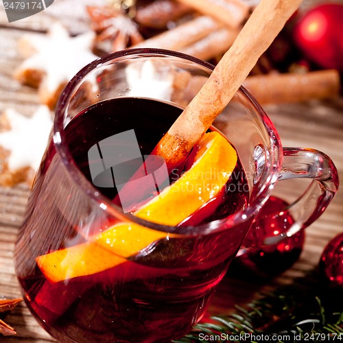 Image of hot tasty spicy mulled red wine with orange and cinnamon christmas 