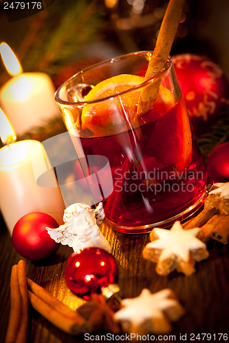 Image of hot tasty spicy mulled red wine with orange and cinnamon christmas 