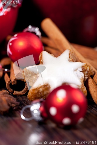 Image of fresh tasty christmas cinnamon cookies and sticks decoration 
