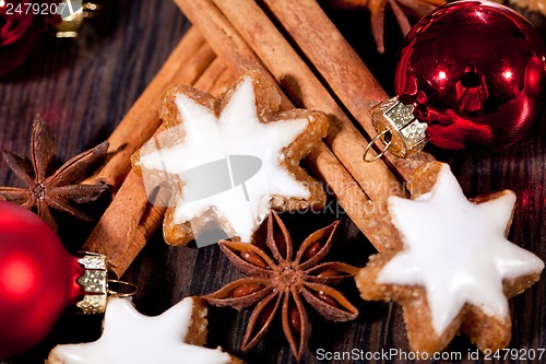 Image of fresh tasty christmas cinnamon cookies and sticks decoration 