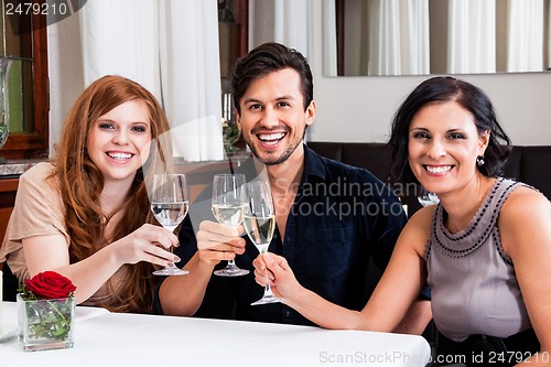 Image of smiling happy people in restaurant