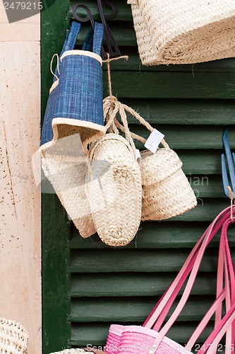 Image of handmade colorful straw handbags on market sale summer