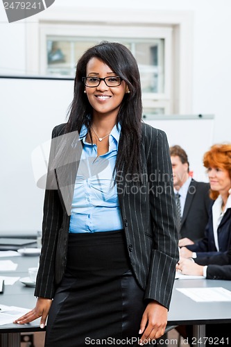 Image of business team on table in office conference